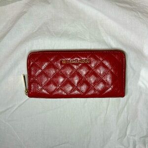 Michael Kors; red quilted wallet w/ gold hardware. Card holder & inside pocket.